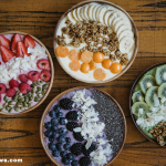 A colorful spread of gut-healing superfoods including kimchi, kefir, chia seeds, and bone broth.