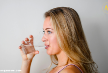 Woman drinking warm water in the morning for health benefits