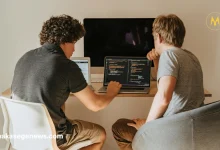 "A young African developer working on artificial intelligence software on a laptop"