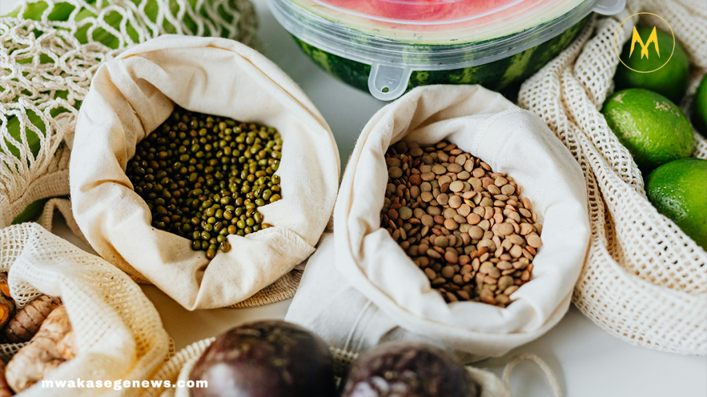 A flat lay of healthy superfoods like blueberries, spinach, yogurt, and salmon.