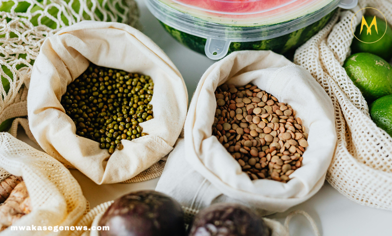 A flat lay of healthy superfoods like blueberries, spinach, yogurt, and salmon.
