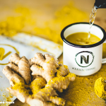 Bright and colorful anti-inflammatory detox drinks in glass jars with fresh ingredients.