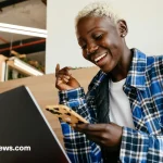 A young entrepreneur running a small business in Tanzania without a loan