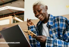 A young entrepreneur running a small business in Tanzania without a loan