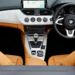 CarPlay Ultra system displaying navigation on a car touchscreen