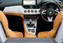 CarPlay Ultra system displaying navigation on a car touchscreen