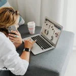 Person working remotely on laptop in a relaxed space