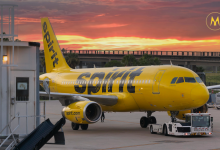 Spirit Airlines airplane taking off at airport