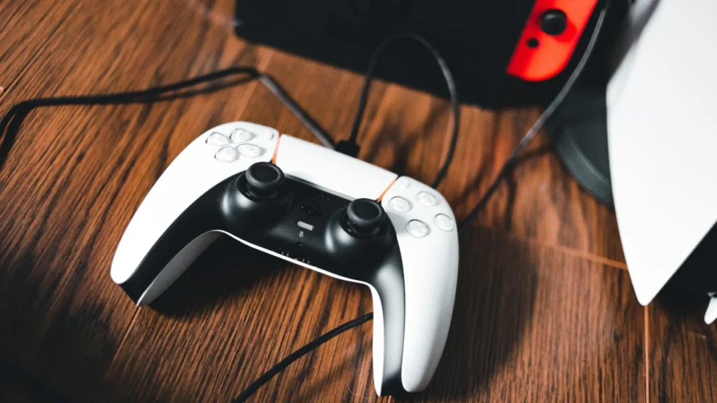 PS5 and PS5 Pro side-by-side comparison showing console design and controller