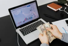 Creator earning online revenue with laptop and digital tools