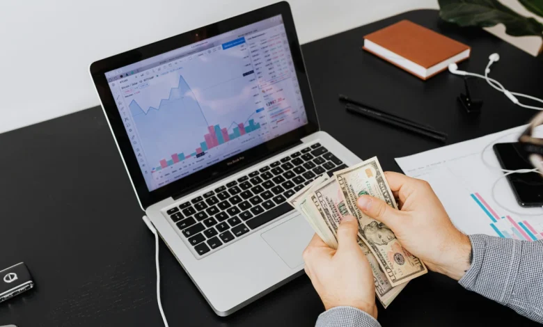 Creator earning online revenue with laptop and digital tools