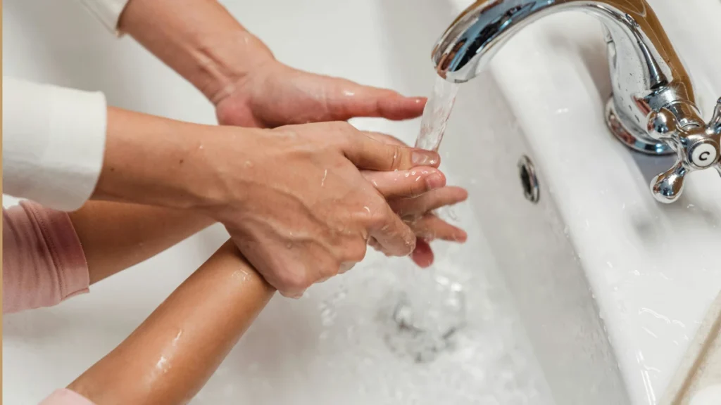 Person washing hands to prevent Shigella infection
