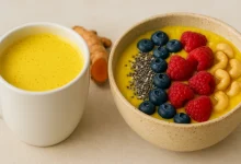 Golden turmeric latte and smoothie bowl on a table