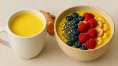 Golden turmeric latte and smoothie bowl on a table